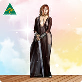 Cardboard cutout of a woman in a long dress holding a sword on a wooden floor with a colorful gradient background.